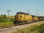 UP 6940 has just passed under Highway 145 and is approaching Fonda Siding